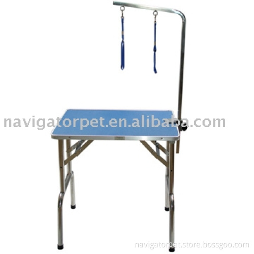 Dog grooming table with arm